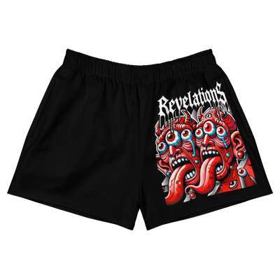 Black Twin Devils athletic shorts with a graphic of red devil faces and the word "Revelations" on the right leg, made of moisture-wicking recycled polyester with a 2.5-inch inseam and elastic waistband.